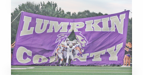 Cal Faulkner leads the Lumpkin County High School football team onto the field during a game last season.  Faulkner is looking ahead to his senior season at Lumpkin, but has already committed to Georgia Tech.