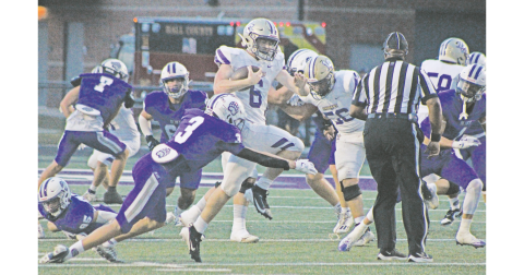 Lumpkin County’s Nolan Matthews fights his way through the Cherokee Bluff defensive line in last week’s game.