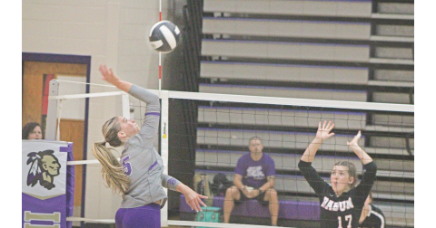 LCHS player Maddie Lee lands a spike against Rabun County.
