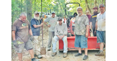 Residents living off of Syrup Mill Road pause for a quick photo during a busy day of repairs. The impromptu road crew consisted of (left to right) Don Thomas, Rick Morris, Chris Pisarik, Jack Harshbarger, Patrick Hayes, Edward Wells, Austin Hayes and Dave McDowell. Not pictured are Michell Pisarik, Lee Goff, Amanda Thomas and Fred Noble.