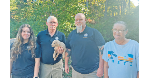 Pictured, from left, Animal Control Technicians Jeannie Knight and Tony Ashe, Animal Shelter Manager Wayne Marshall and River Flow Drive resident Melissa Bouchez are all in a more relaxed mood after rescuing a puppy from a nearby drainage pipe.