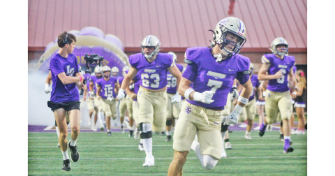 The Indians storm the field ahead of their game against Dunwoody.