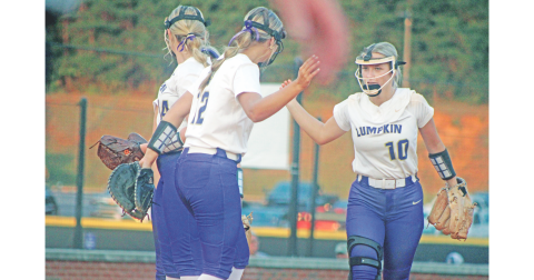 Lumpkin’s LaDalle Carpenter high-fives teammates as she takes the field against Dawson County.