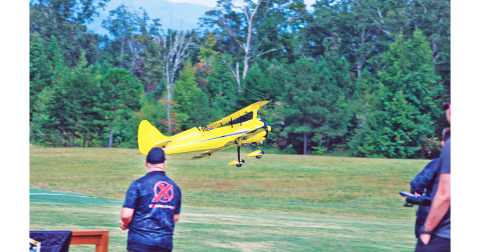 A pilot commandeers his remote control biplane during last year’s Extreme Fun-Fest Fly-in. The annual RC airshow attracts participants from across the country and serves as the largest fundraiser for North Georgia Model Aviators, a charity group focusing on education and community participation.