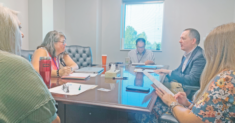 Georgia Safe Routes to School program coordinator Nick Anderson, second from right, discusses the details of the upcoming LCMS Walking School Bus event with, from left, Transportation Director Lynn White, LCMS Principal Libbie Armstrong, Chief Operations Officer Greg Trammell and Cottrell Elementary School Principal Stacie Gerrells. More Safe Route events, like an elementary school bike rodeo, are in the works for later in the school year.