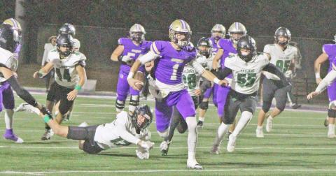 Senior Cal Faulkner hits a hole in North Hall’s defense and takes off during this week’s game. 