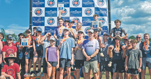 The Lumpkin County mountain bike team (center) stands atop the podium.