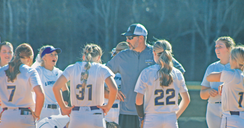 Coach Joseph Jones rallies his players ahead of their State Playoff game against Jefferson.