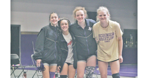 Lumpkin County team captains Kylee Melton, Cadence Grulla, Nora Garbuzovas and Greta Garbuzovas gather together before their match against Chestatee.