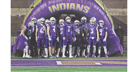 The Indians prepare to storm the field together ahead of their State Playoff game against LaGrange last Friday.