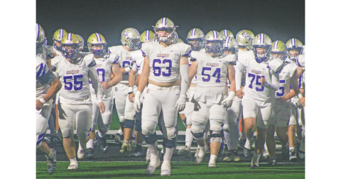 Zeke Cochran takes the field backed by the rest of the Indians at this week’s game in Pickens County. 