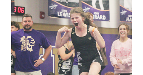 Darlene Steinberg celebrates an exhibition match victory at this week’s middle school Tri-Meet.
