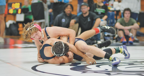 Lumpkin County wrestler Hunter Cook fights for positioning against his opponent.