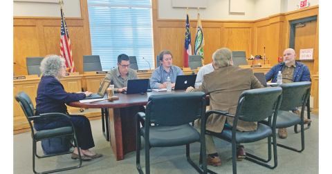 Members of the Dahlonega City Council discuss the merits of shifting back to the time-tested radio system for employee communication.
