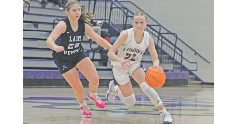 Lumpkin County’s Anna Davis plows her way down the court against the Rebels.
