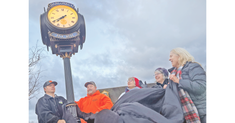The recently donated downtown Rotary Club clock is officially unveiled Thursday morning with the assistance of, from left, Troy Armstrong, Justin Priest, past Rotary president Diane Bates, Mayor JoAnne Taylor and Rotary Assistant Governor Barbara Myers Mason.