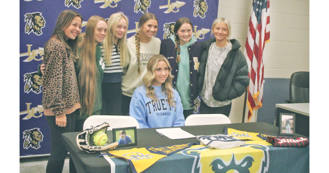 Lumpkin County softball player Julianna York celebrates her signing day alongside her teammates. 