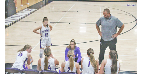 Head Coach Tess Wright talks things over with her Lumpkin County girls team.