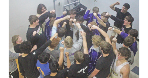 The Lumpkin County High School wrestling team breaks things down ahead of its finals match against Dawson.