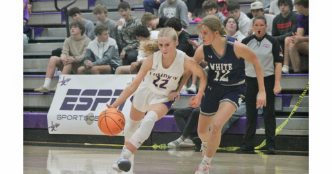 Lumpkin County player Anna Davis drives down the court for the Lady Indians.