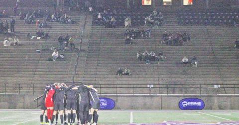The Lumpkin County High School boys soccer team takes a moment to focus before the game.