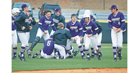 The Lumpkin County High School baseball team storms the field following their walk-off win against Fannin.