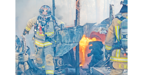 Lumpkin County firefighters work to contain the burning remains of a structure fire off Camp Wahsega Road. (photo by John Bynum)