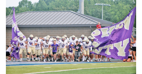 The Lumpkin County High School football team storms the field ahead of their Spring Game.