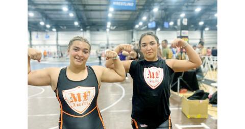 Natalie (left) and Mattie Mendoza showed their strength at the NHSCA National Duals meet.
