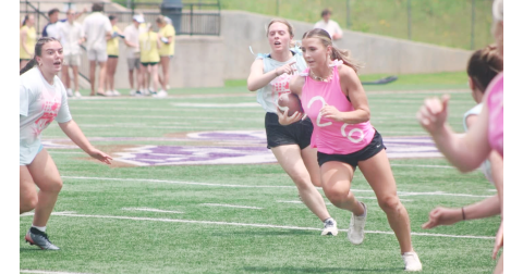 Lumpkin softball standout Cadence Ivey plows down the field during the recent powderpuff football game.