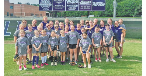 Youth soccer campers and varsity players gather at last week’s camp.