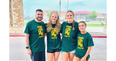 Pictured, from left, Lumpkin wrestling coach Scott DeGraff, Greta Garbuzovas, Faith Jones and Cadence Grulla gather outside the Fargo Dome in North Dakota.