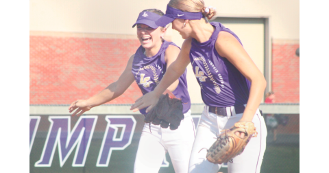 Lumpkin County High School softball players Maddox Henderson (left) and  Abi Kate Webb celebrate a great play at last week's summer game.