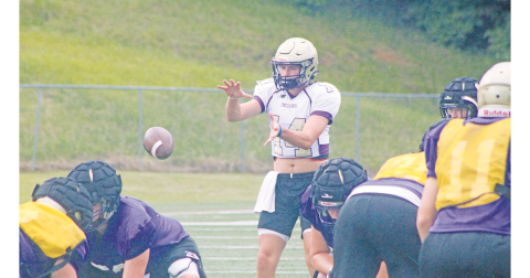 Lumpkin County’s Mason Hester takes a snap during last week’s practice at LCHS.