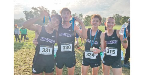 Pictured (from left): Paulo Ramirez, Nickson McGillivray, Bowen Aiken and Ari Cook celebrate the cross country team’s recent race accomplishments.