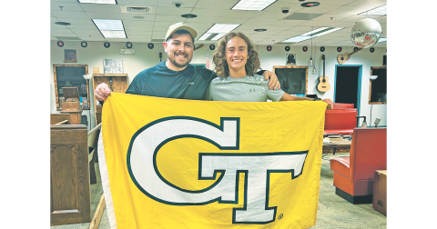 Will Mayfield gifts Wyatt Windham his Georgia Tech flag that flew in Afghanistan while he served in the U.S. Army National Guard.