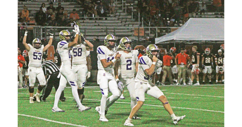 The Indians celebrate after Caleb Wendl (right) secures the game-ending first down over Hart County on the road last Friday.