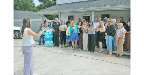 South Enotah Child Advocacy Center Executive Director Rebekah Perethian speaks to a crowd of donors, volunteers and well-wishers at the grand opening for the non-profit’s new Dahlonega location.