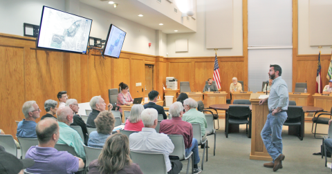 Warren Welch, Project Manager for The Overlook development, answers questions from the public about his amended PUD zoning proposal during a packed meeting of the Dahlonega Planning Commission.