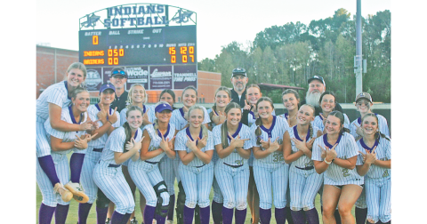 The Lady Indians celebrate their blowout win over Riverdale, which allowed the team to advance in the State Playoffs.