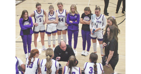 Lumpkin County Girls Basketball head coach Brian Richerson talks strategy with his team.
