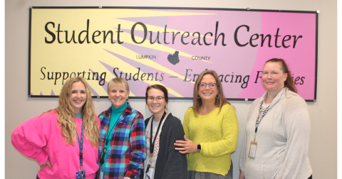 Pictured at the local Student Outreach Center are (from left) Coordinator Makenzy Horne, LBES Family Advocate Patricia Jarvis, CES & LCMS Family Advocate Taylor Anderson, Lumpkin County Family Connections Director Brigette Barker and Backpack Buddies Attendant Jennifer Trotter.