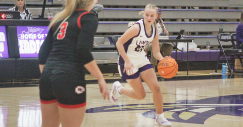 Anna Davis drives down the court for the Lady Indians.