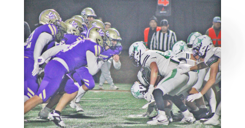 Lumpkin County’s defense charges at the Pickens offensive line during a fourth down play in last week’s matchup.