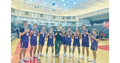 The Lumpkin County boys basketball team celebrates their historic start after defeating GAC.