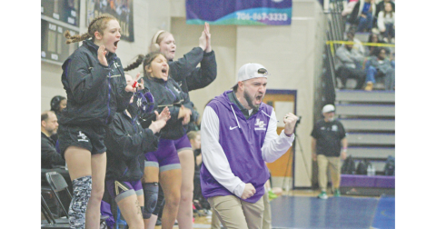 Scott Degraff and the Lumpkin County Girls Wrestling team celebrate a big win at last year’s State Championships.