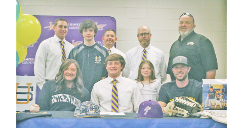 Mason Hester attends his signing day surrounded by coaches, friends and family.