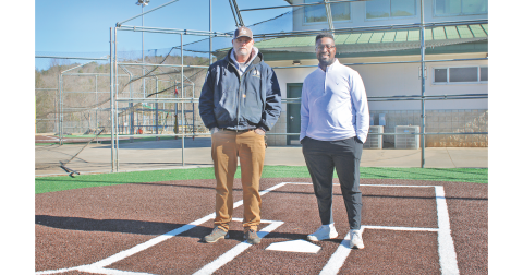 Lumpkin County Parks & Rec Field Maintenance Supervisor Steve Cuny (left) and Athletic Director Ahmad Kamara stand at home plate on one of two renovated Cloverleaf ballfields, which feature artificial turf infields and natural grass outfields.
