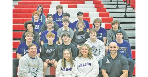 The Lumpkin County boys’ wrestling team celebrates their win following the Morgan County Duals.