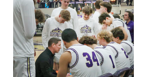 Lumpkin County Head Coach Chris Faulkner talks strategy with his team as they take on the Tigers.